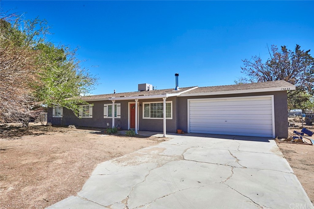 15833 Wichita Road Apple Valley, CA 92307 - Photo 1 of 1 a view of a house with a yard