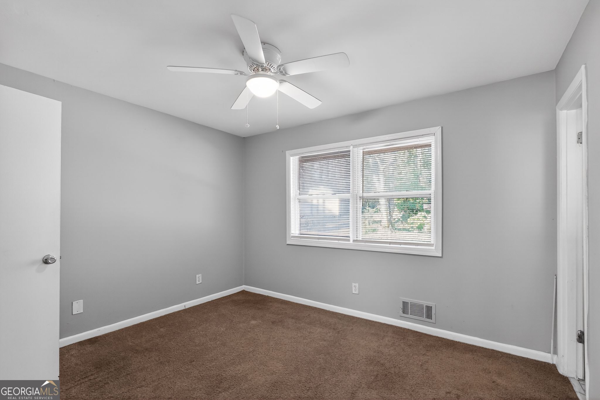 2522 Brentwood Court Decatur, GA 30032 - Photo 15 of 32 an empty room with windows and fan
