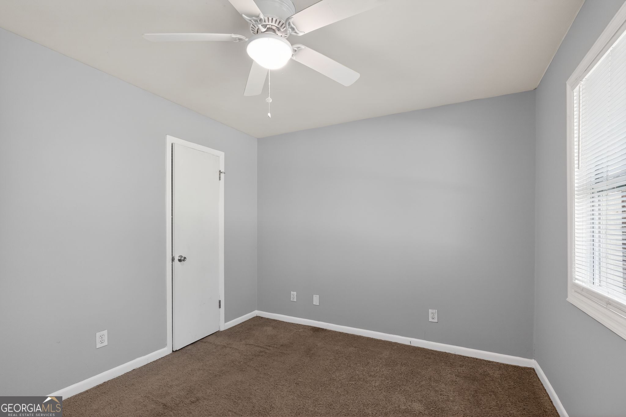 2522 Brentwood Court Decatur, GA 30032 - Photo 18 of 32 an empty room with a window and a fan