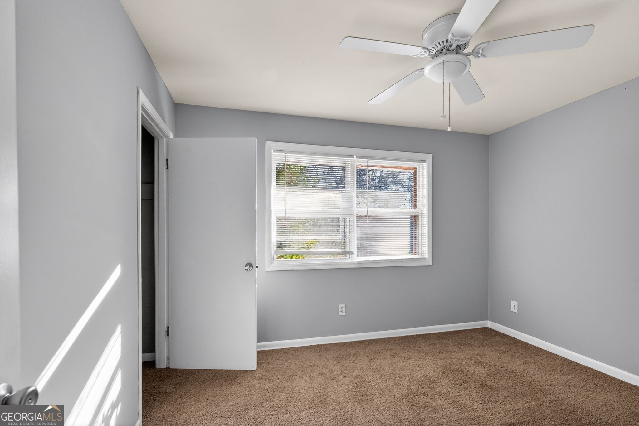 2522 Brentwood Court Decatur, GA 30032 - Photo 19 of 32 an empty room with a window and a fan