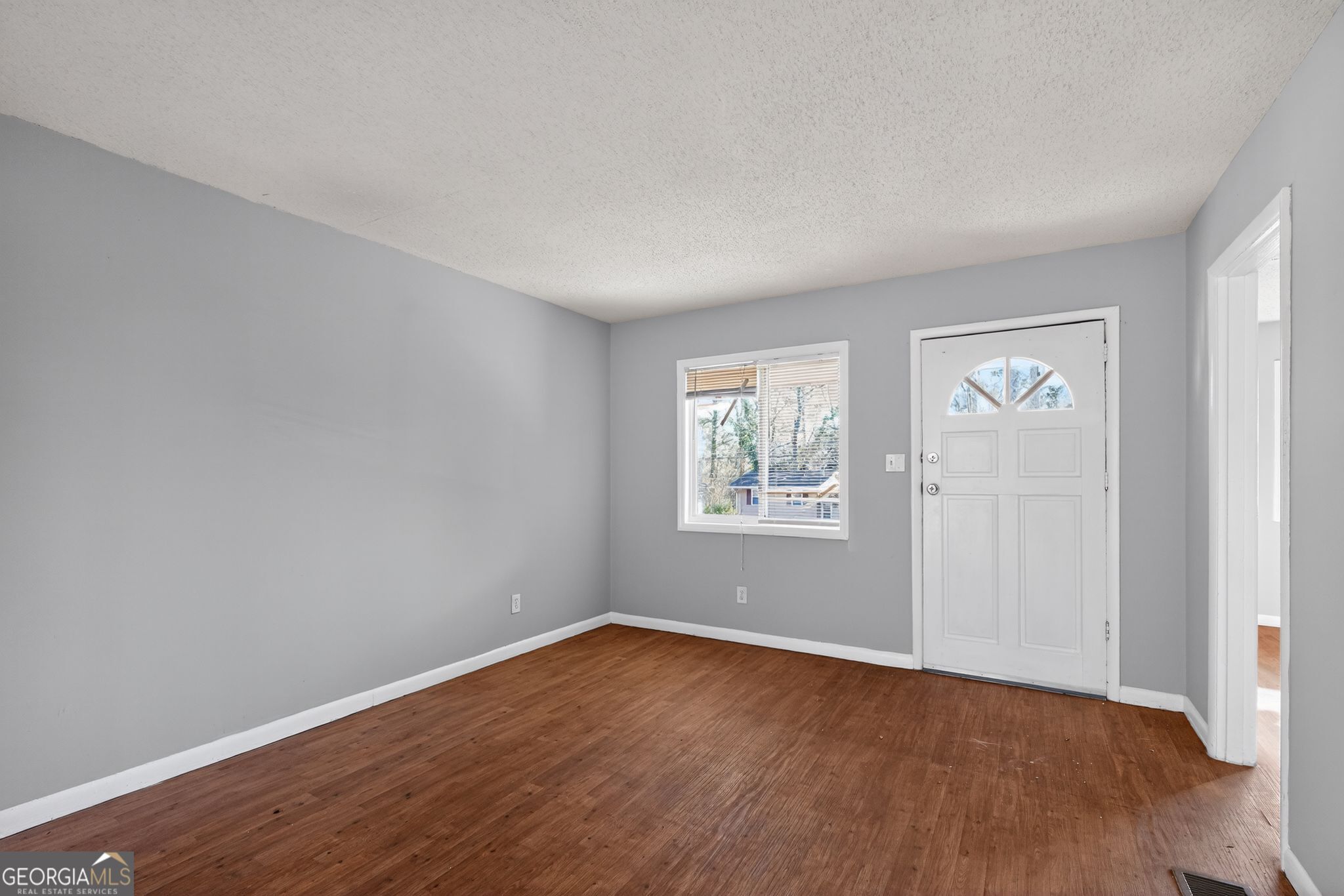 2522 Brentwood Court Decatur, GA 30032 - Photo 4 of 32 an empty room with wooden floor and window