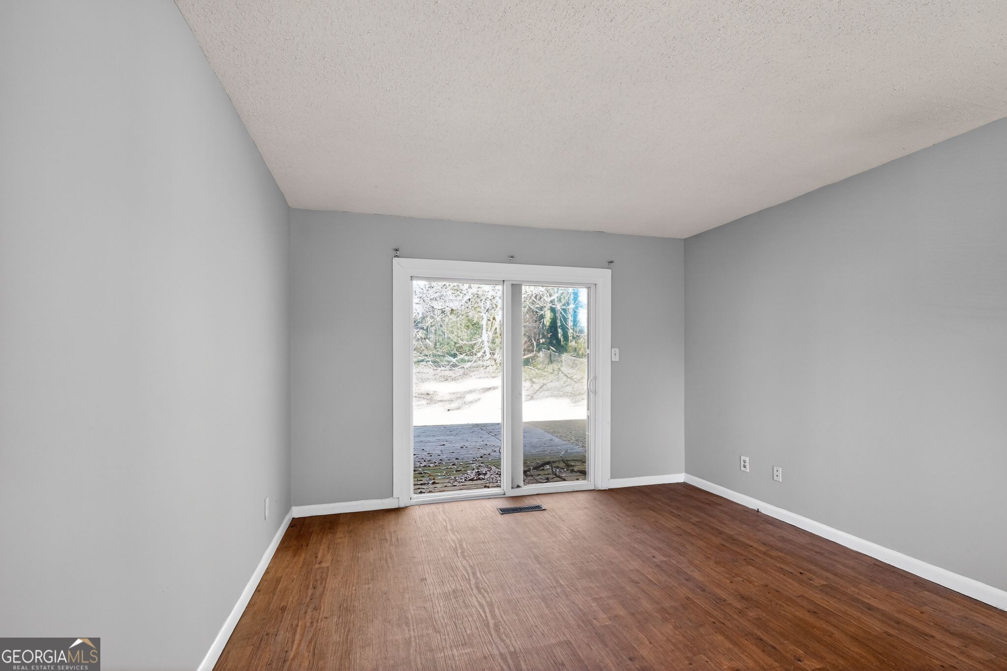 2522 Brentwood Court Decatur, GA 30032 - Photo 6 of 32 an empty room with wooden floor and windows