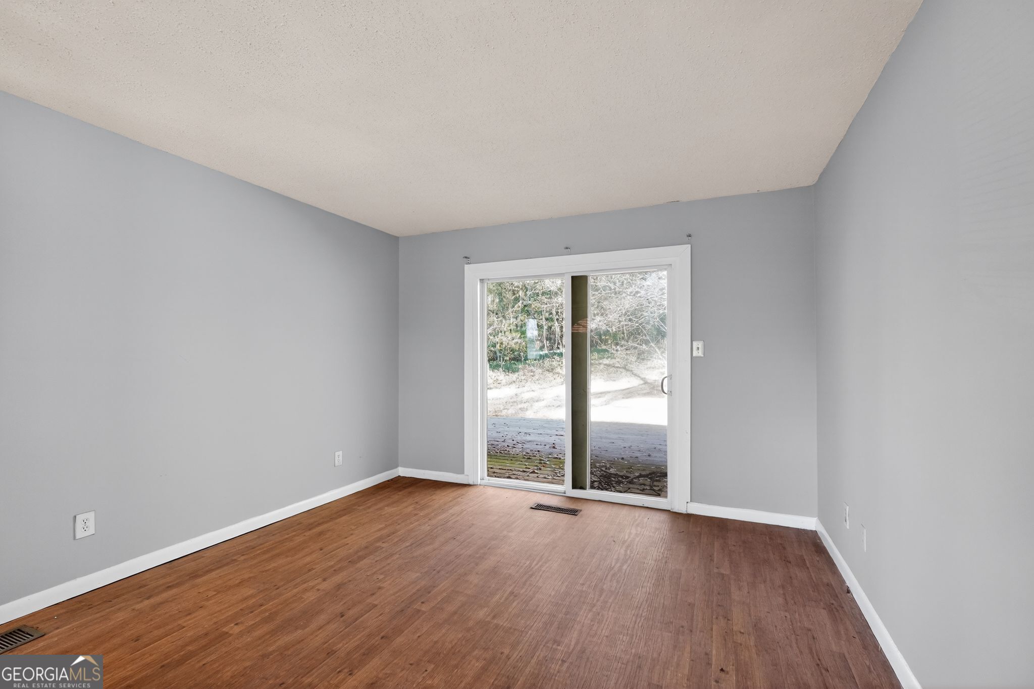2522 Brentwood Court Decatur, GA 30032 - Photo 7 of 32 an empty room with wooden floor and windows