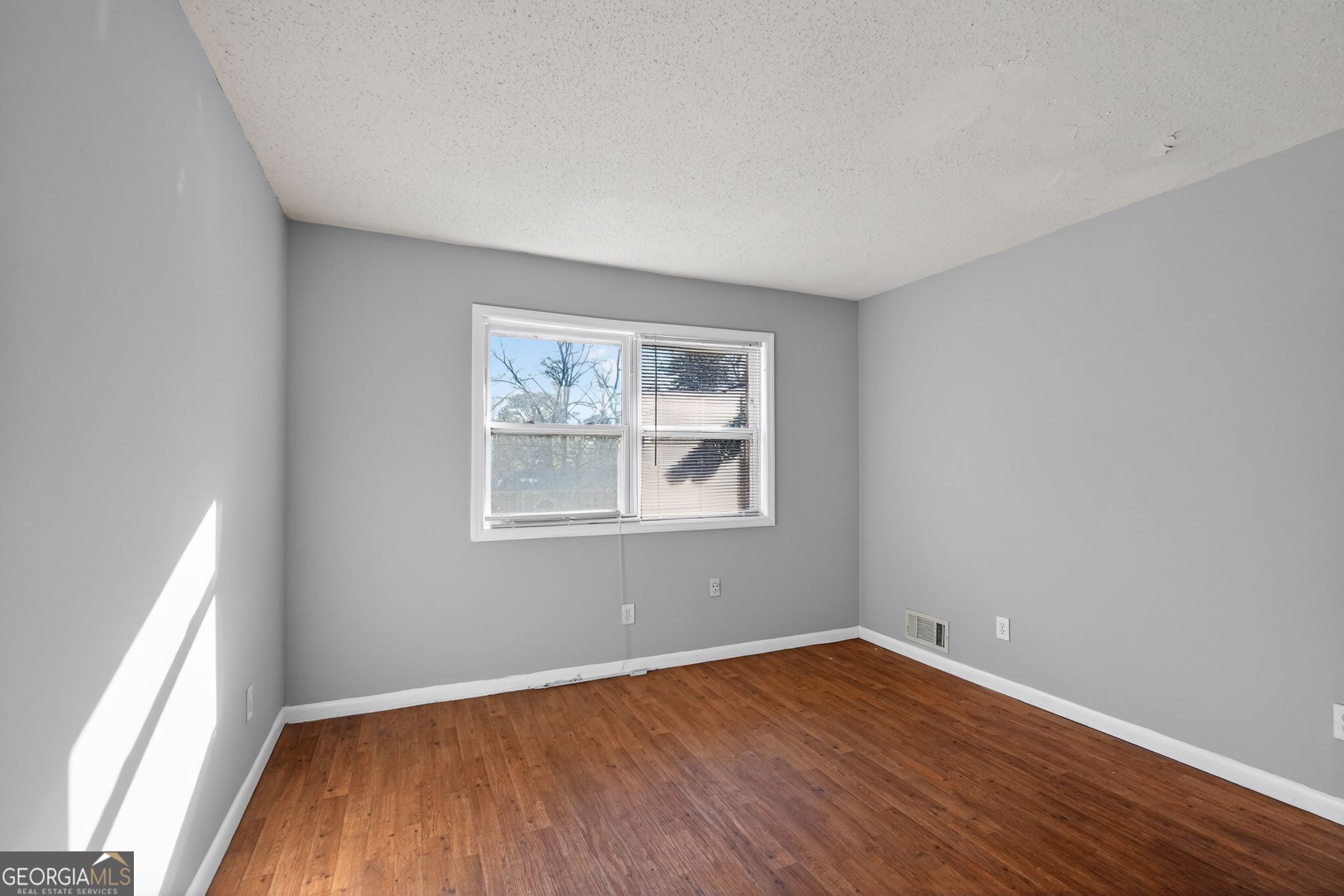 2522 Brentwood Court Decatur, GA 30032 - Photo 9 of 32 an empty room with wooden floor and windows