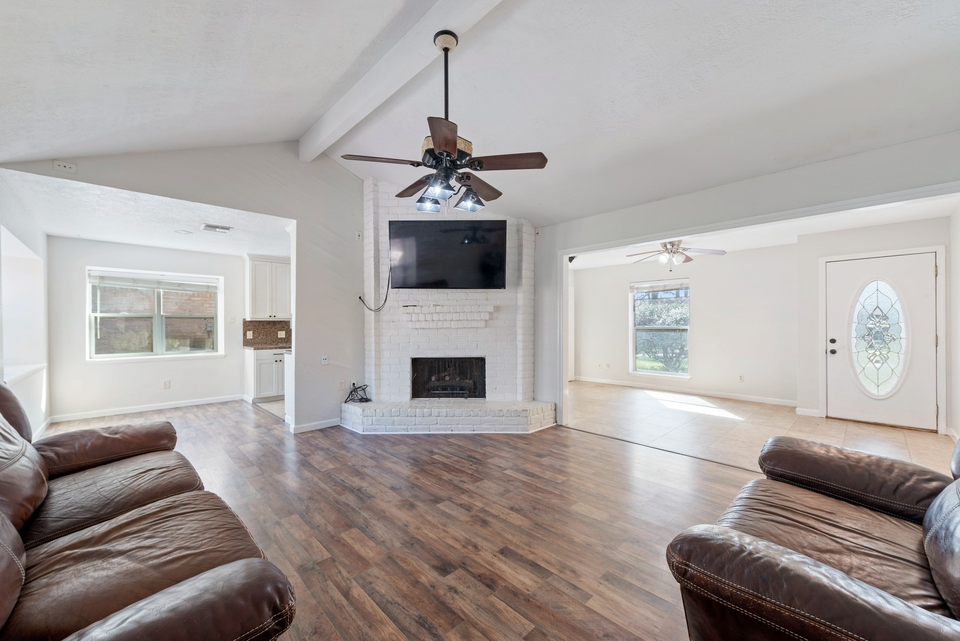 9622 Birsay Street Spring, TX 77379 - Photo 4 of 17 Front living area leads right into back living room with fireplace.