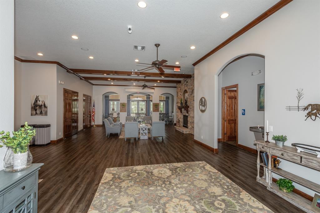 21944 Belgian Court Mount Dora, FL 32757 - Photo 37 of 57 a hall with wooden floor and furniture