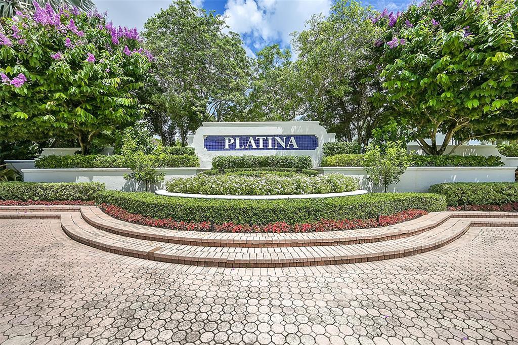 5265 Brisata Circle, Unit E Boynton Beach, FL 33437 - Photo 1 of 30 a sign on the side of a road