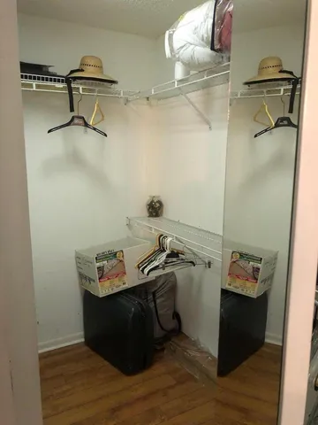 a room with a window and wooden floor