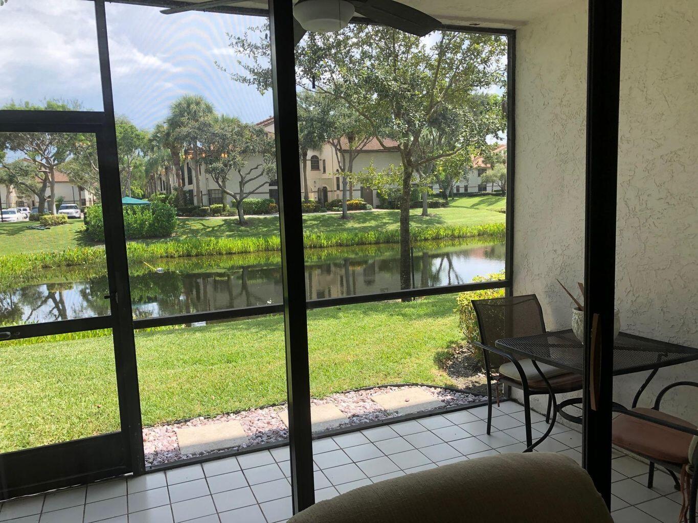 5265 Brisata Circle, Unit E Boynton Beach, FL 33437 - Photo 16 of 30 a view of backyard from window