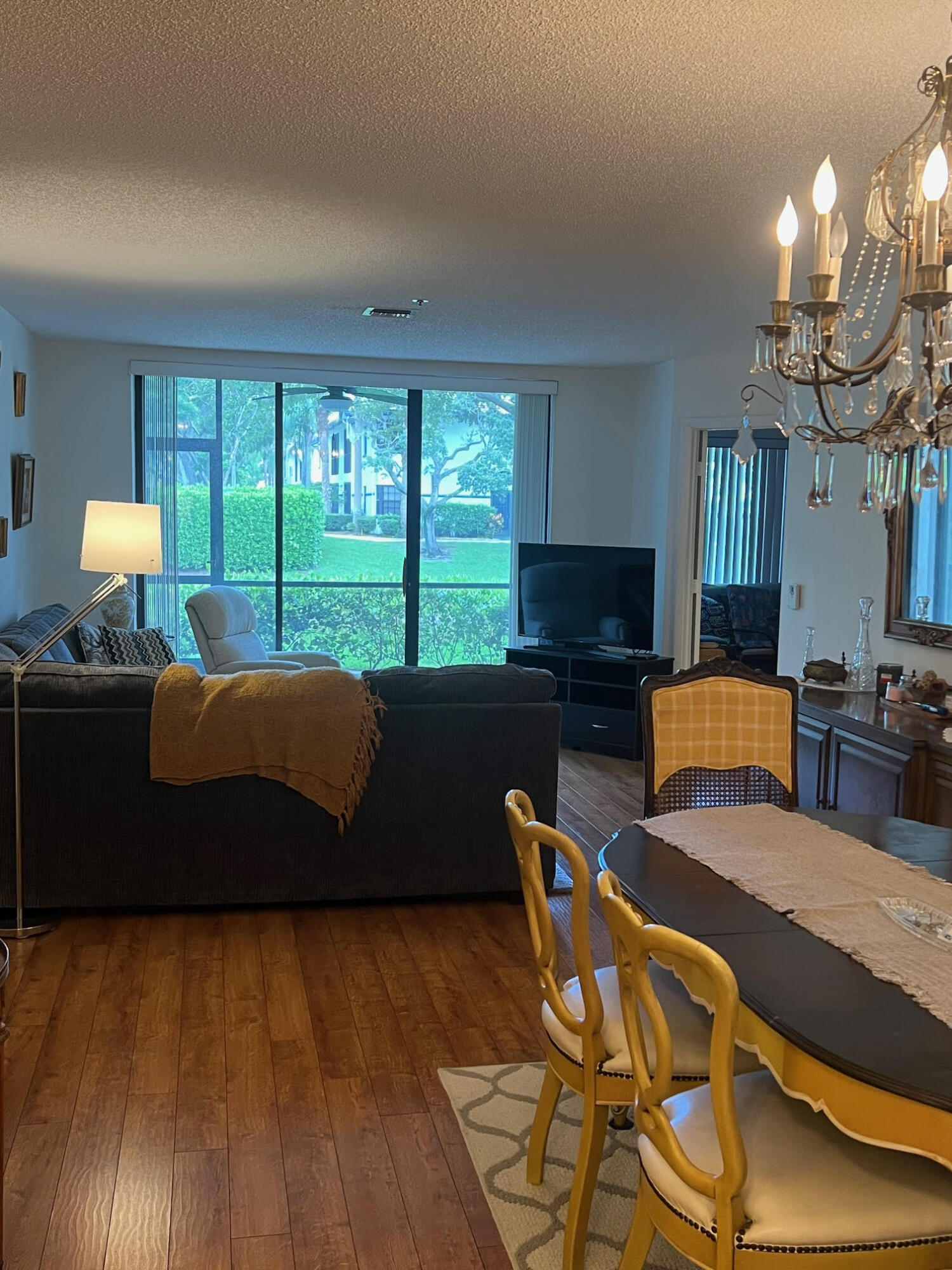 5265 Brisata Circle, Unit E Boynton Beach, FL 33437 - Photo 18 of 30 a bedroom with a bed and wooden floor