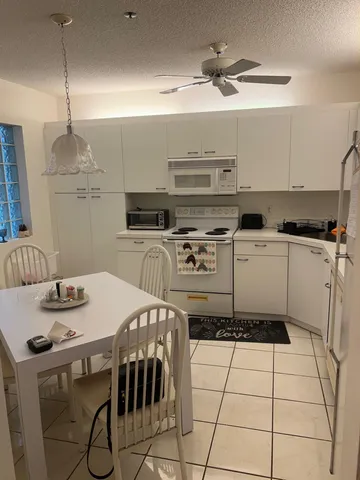 a kitchen with a stove a sink and a refrigerator