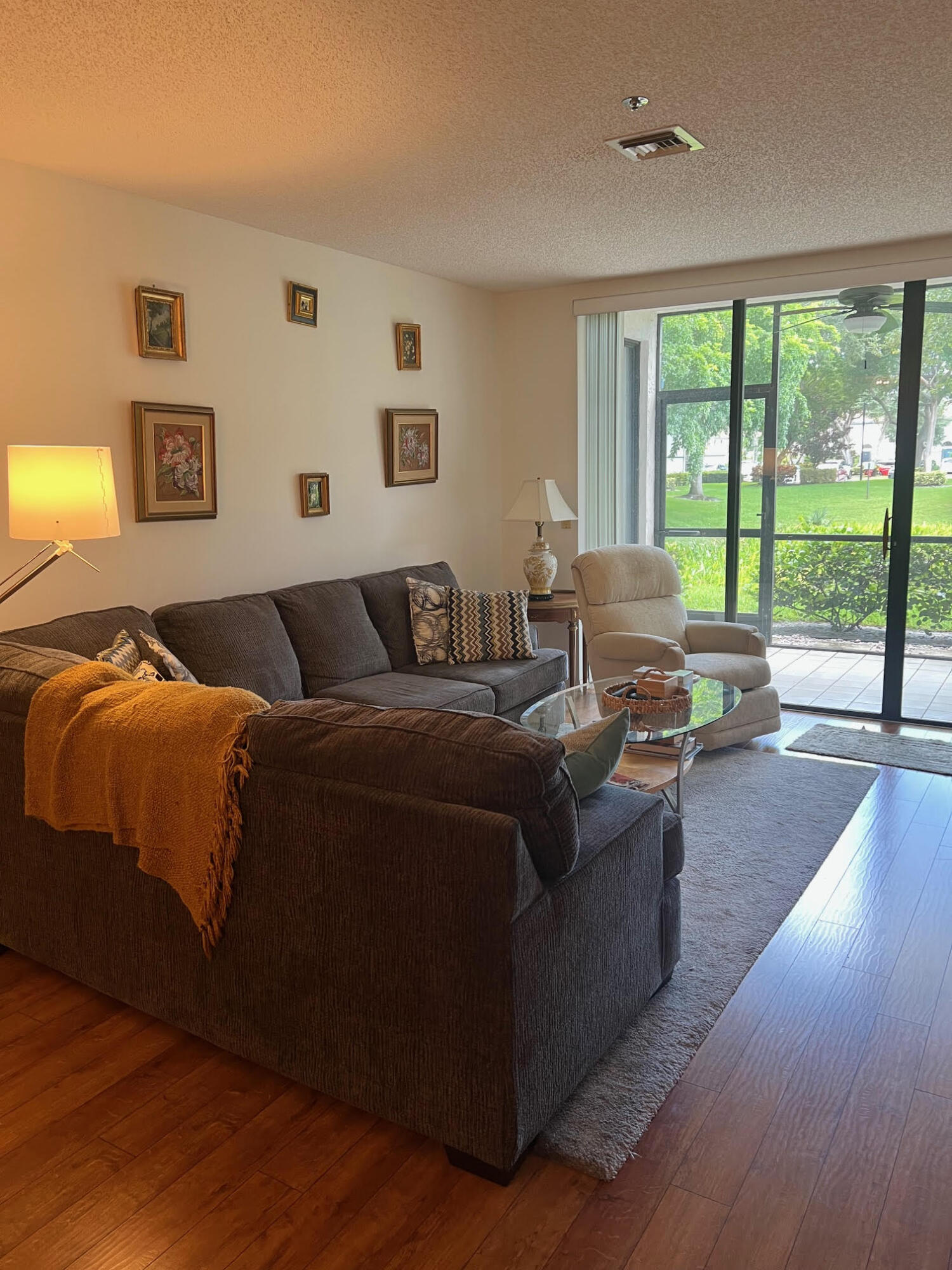 5265 Brisata Circle, Unit E Boynton Beach, FL 33437 - Photo 2 of 30 a living room with furniture and a large window