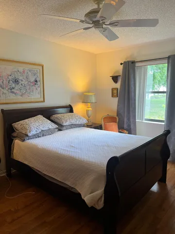 a bedroom with a bed and window