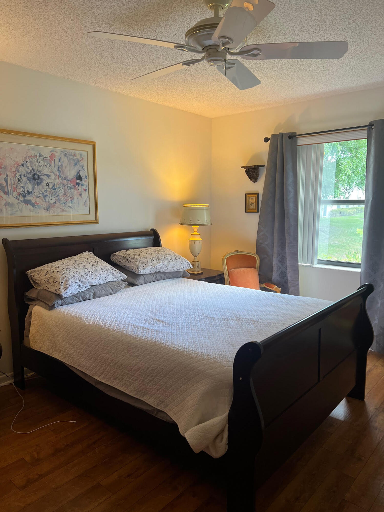 5265 Brisata Circle, Unit E Boynton Beach, FL 33437 - Photo 25 of 30 a bedroom with a bed and window