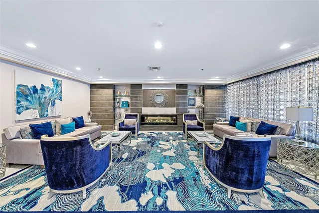 a living room with furniture a window and a table