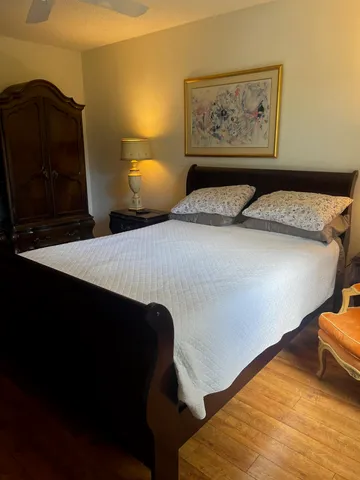 a bedroom with bed and window