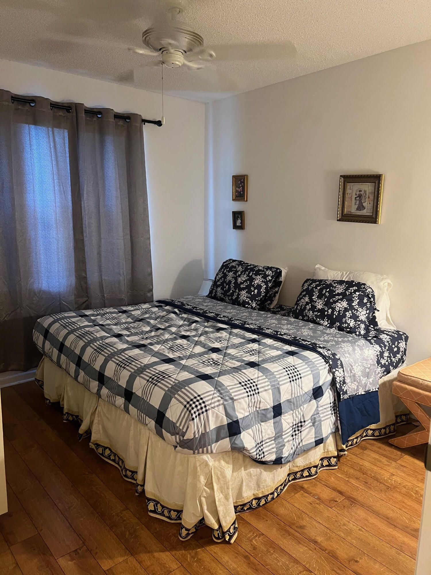 5265 Brisata Circle, Unit E Boynton Beach, FL 33437 - Photo 6 of 30 a bedroom with two beds and a chandelier