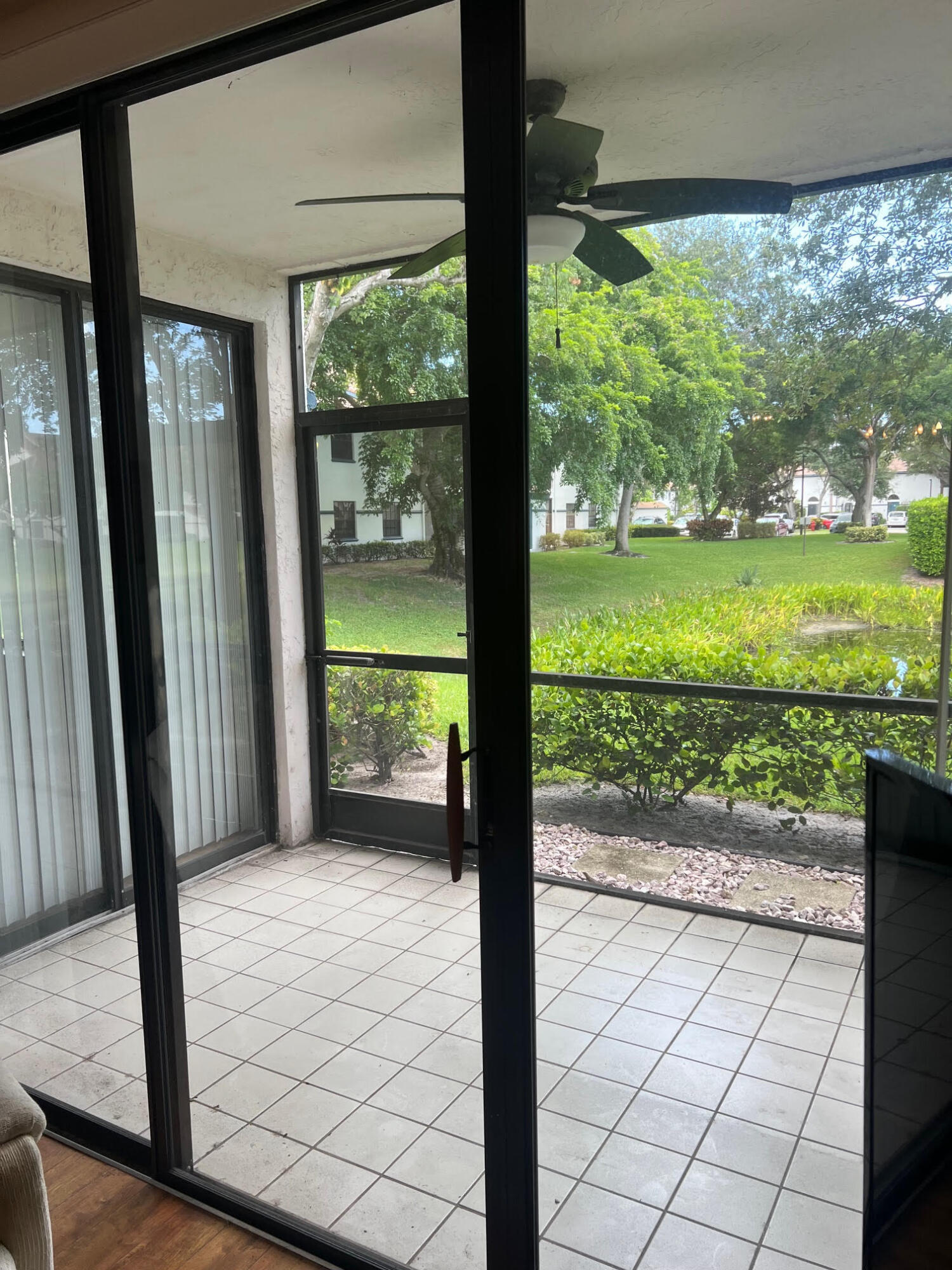 5265 Brisata Circle, Unit E Boynton Beach, FL 33437 - Photo 9 of 30 a porch with a yard