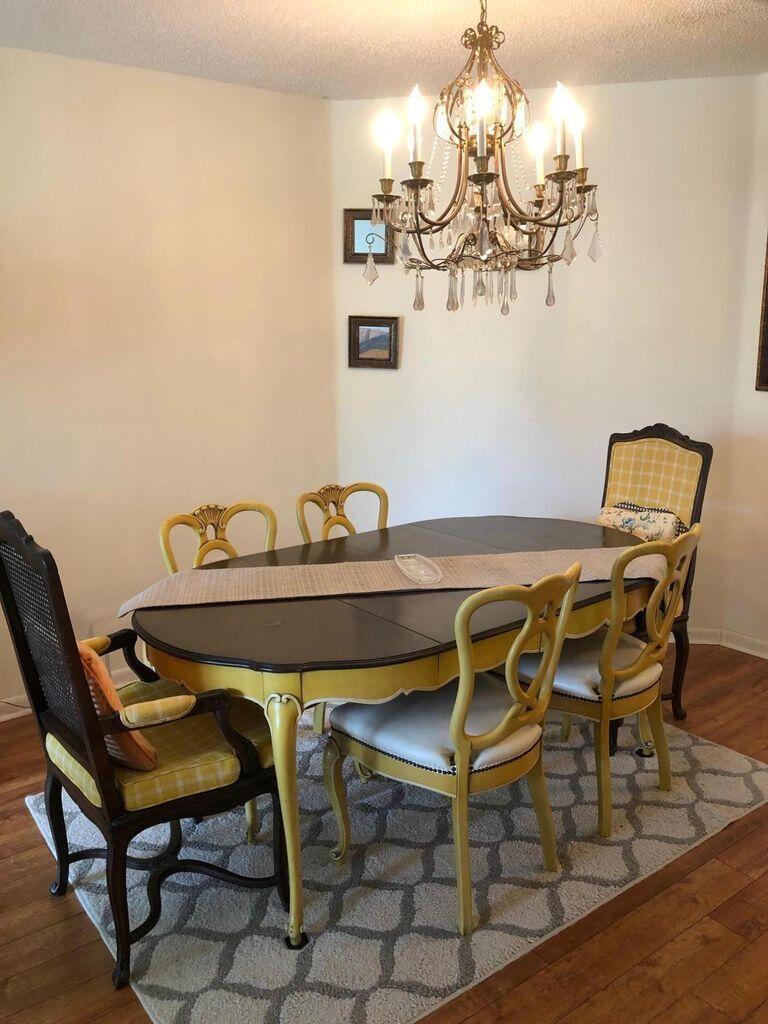 5265 Brisata Circle, Unit E Boynton Beach, FL 33437 - Photo 10 of 30 a view of a dining room with furniture and chandelier