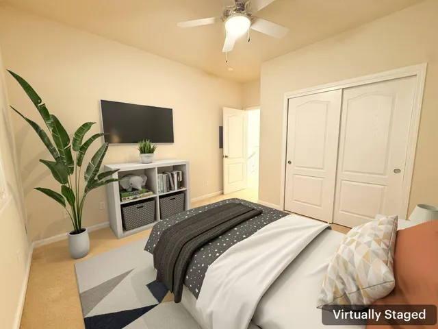 a bedroom with a bed and a television