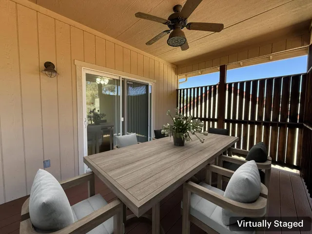 a view of a livingroom with furniture and a table