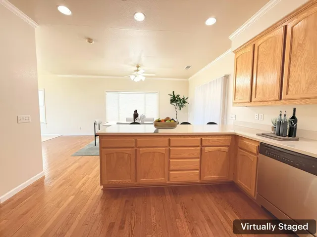 a kitchen with stainless steel appliances sink and cabinets