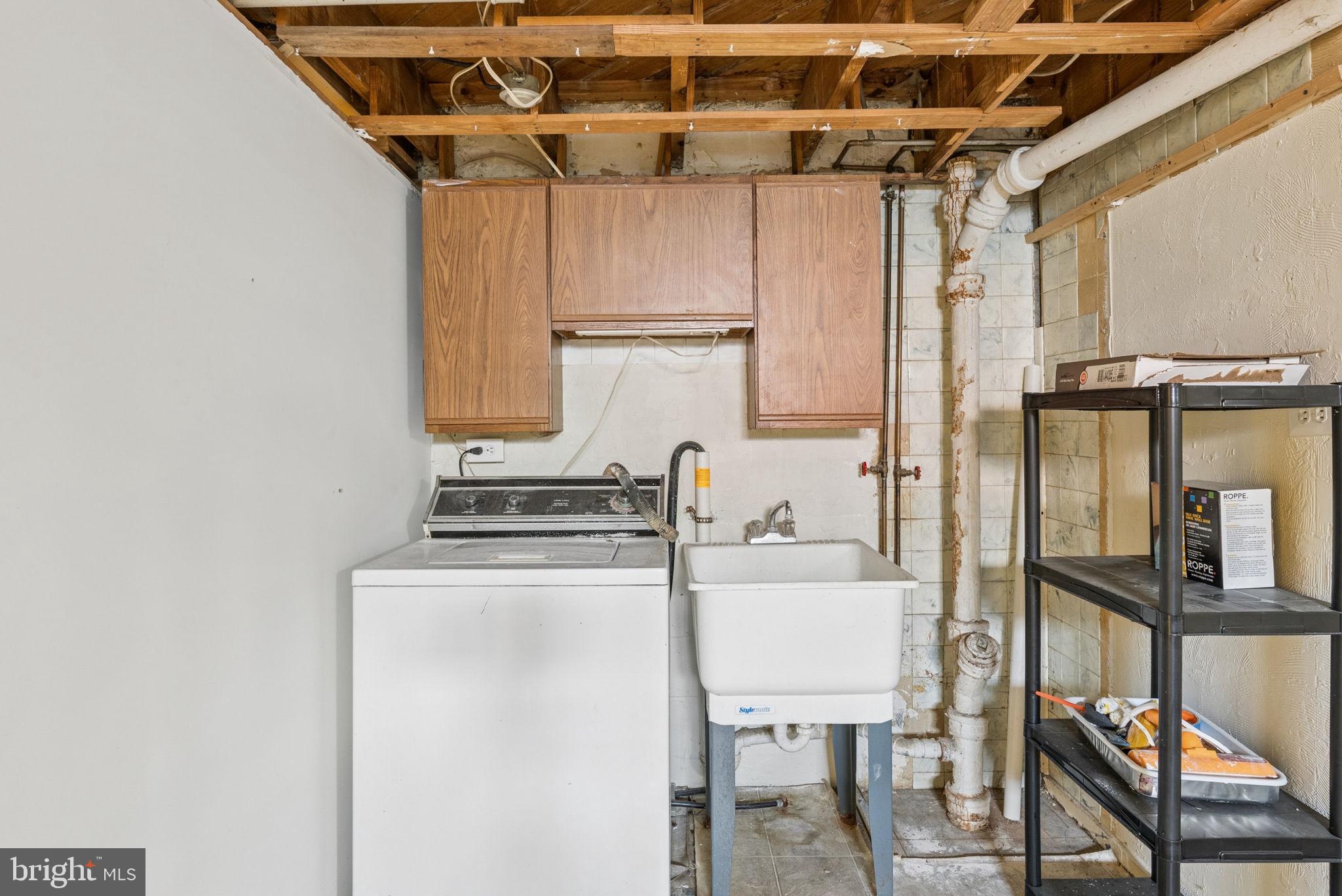 2169 Firethorn Road Baltimore, MD 21220 - Photo 31 of 53 Functional laundry space with storage.