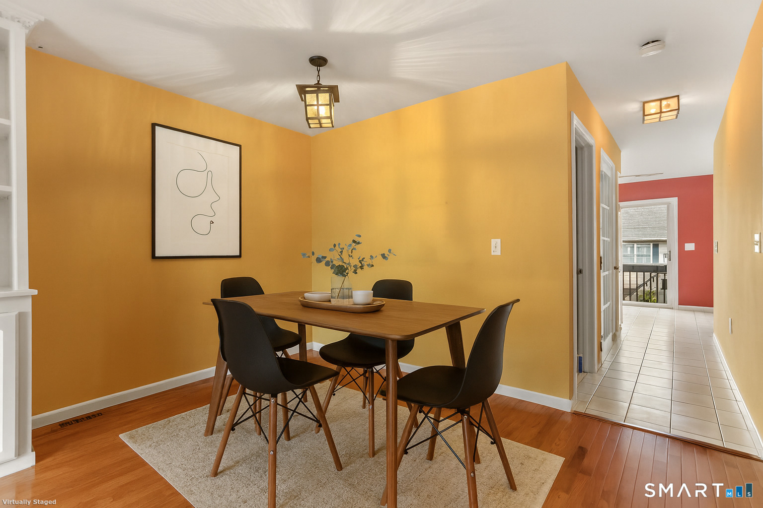 a view of a dining room with furniture and wooden floor