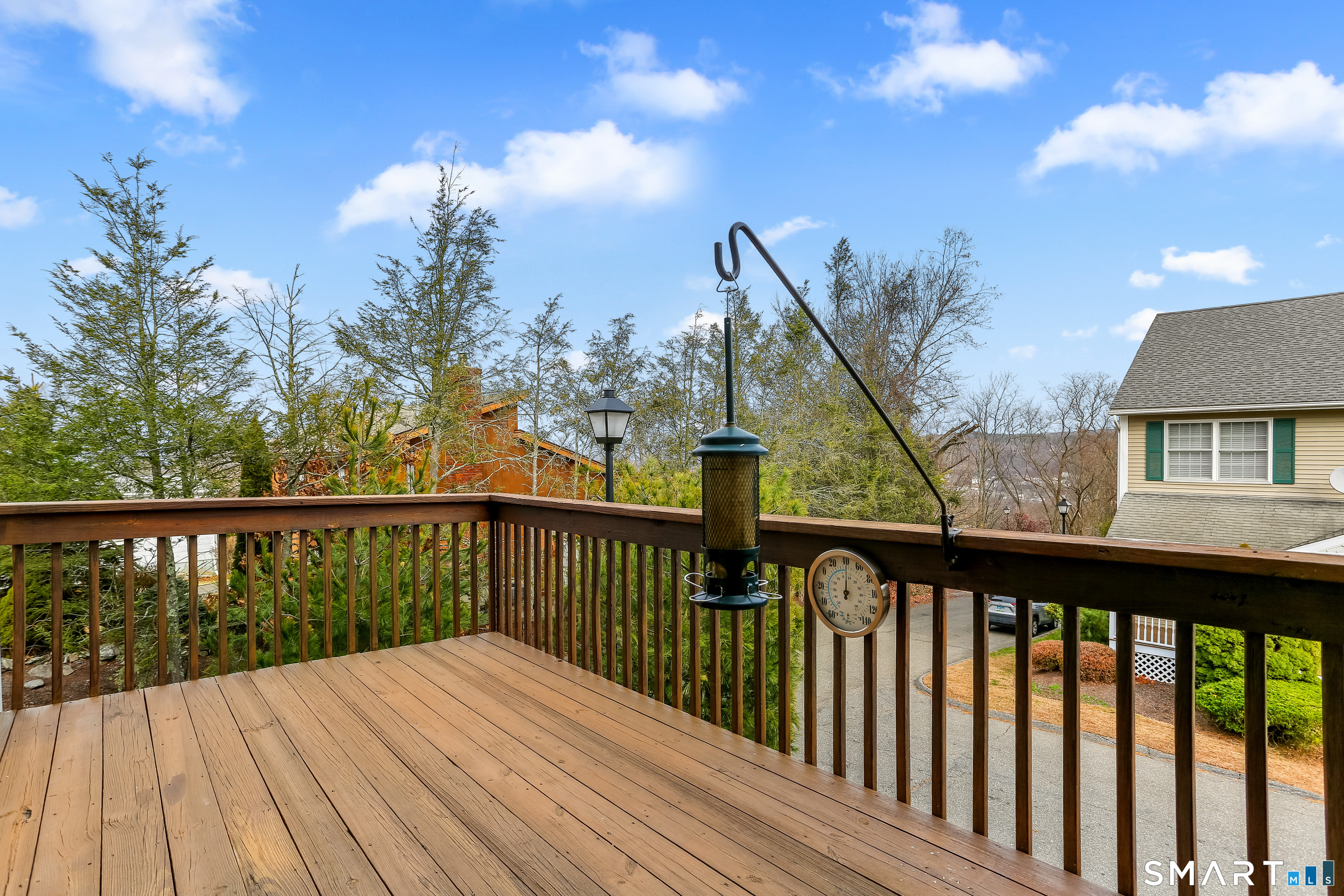 39 Coram Road, Unit 1 Shelton, CT 06484 - Photo 12 of 28 a balcony with wooden floor and fence