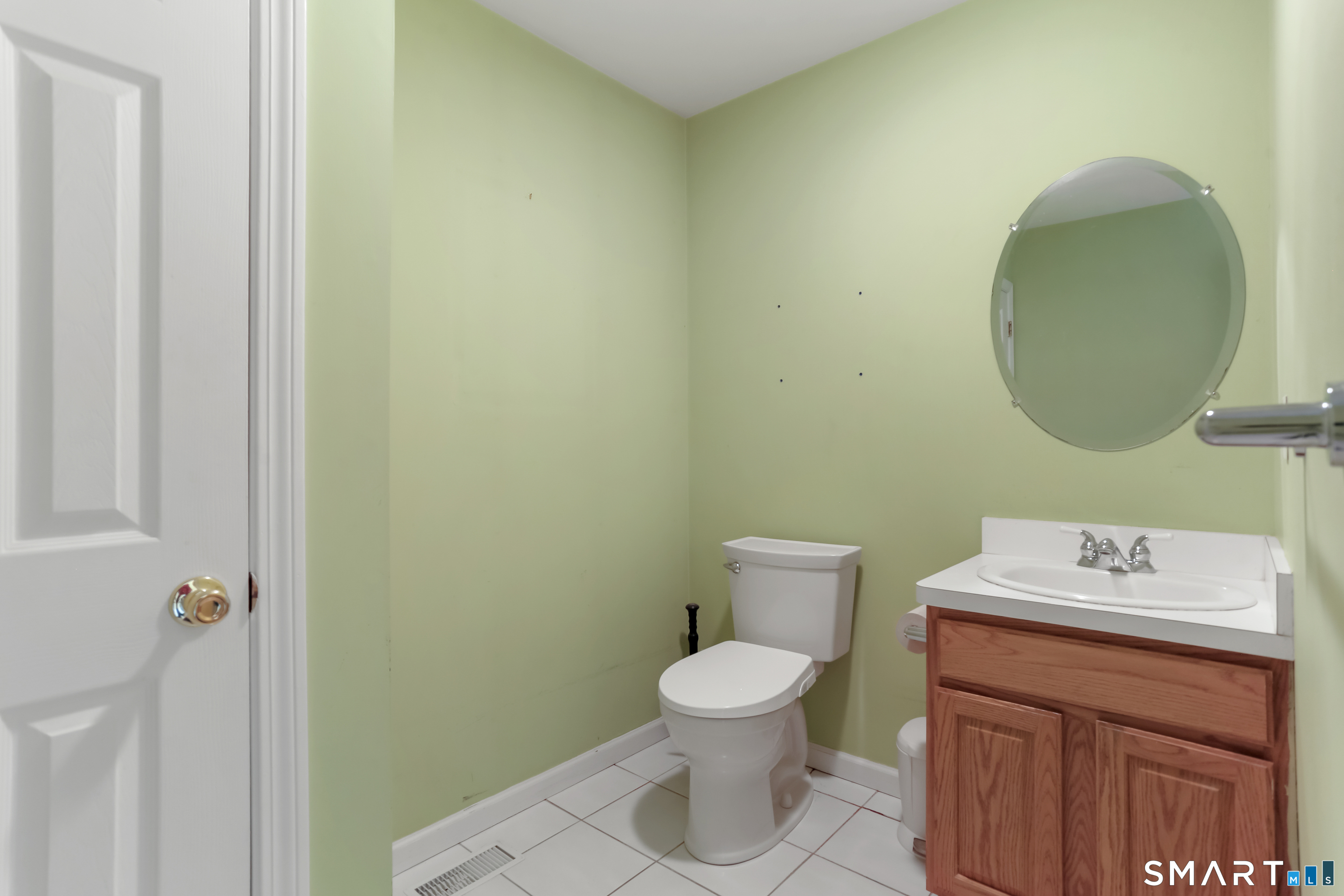 39 Coram Road, Unit 1 Shelton, CT 06484 - Photo 14 of 28 a bathroom with a toilet sink and mirror