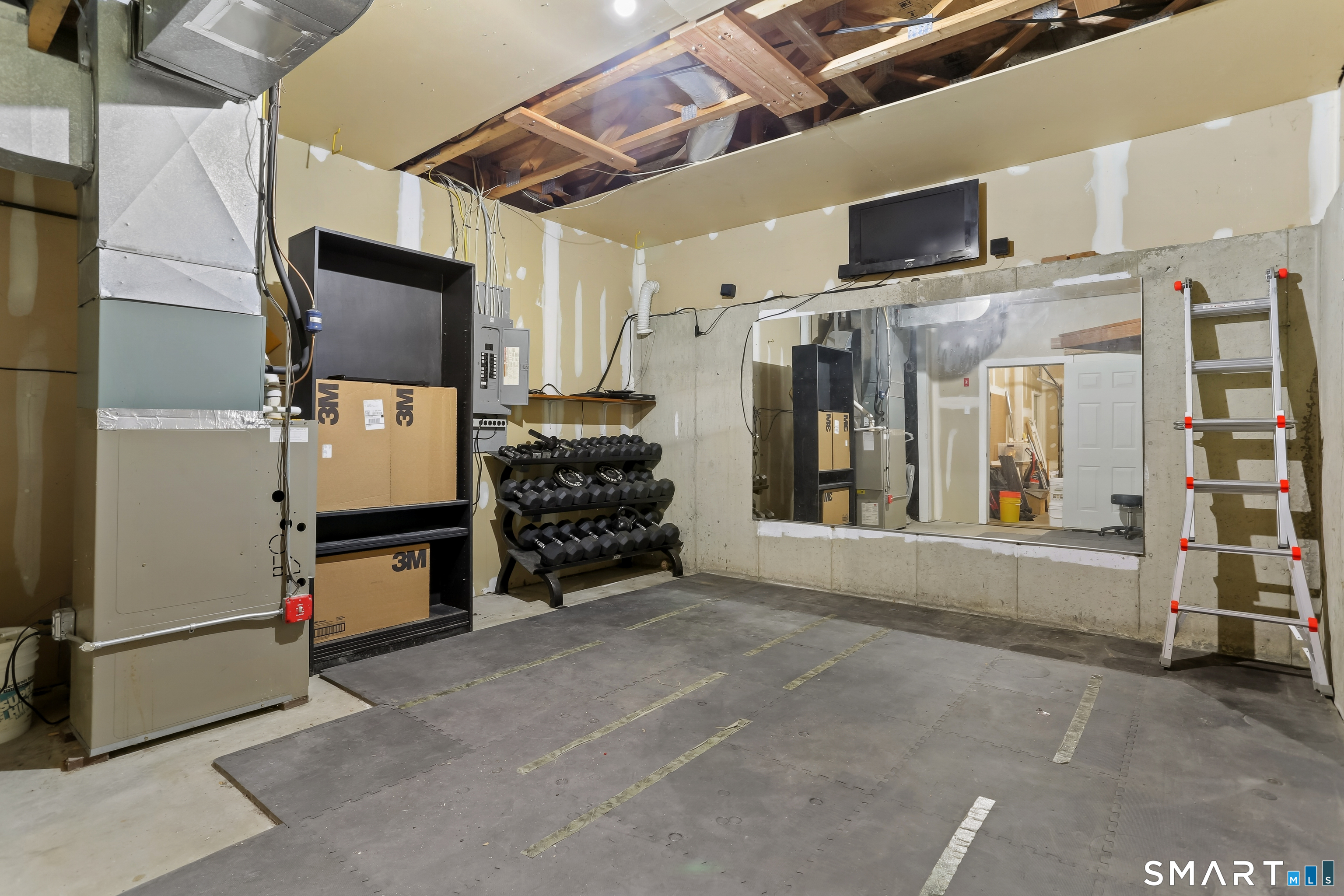 39 Coram Road, Unit 1 Shelton, CT 06484 - Photo 26 of 28 a living room with stainless steel appliances furniture and a flat screen tv