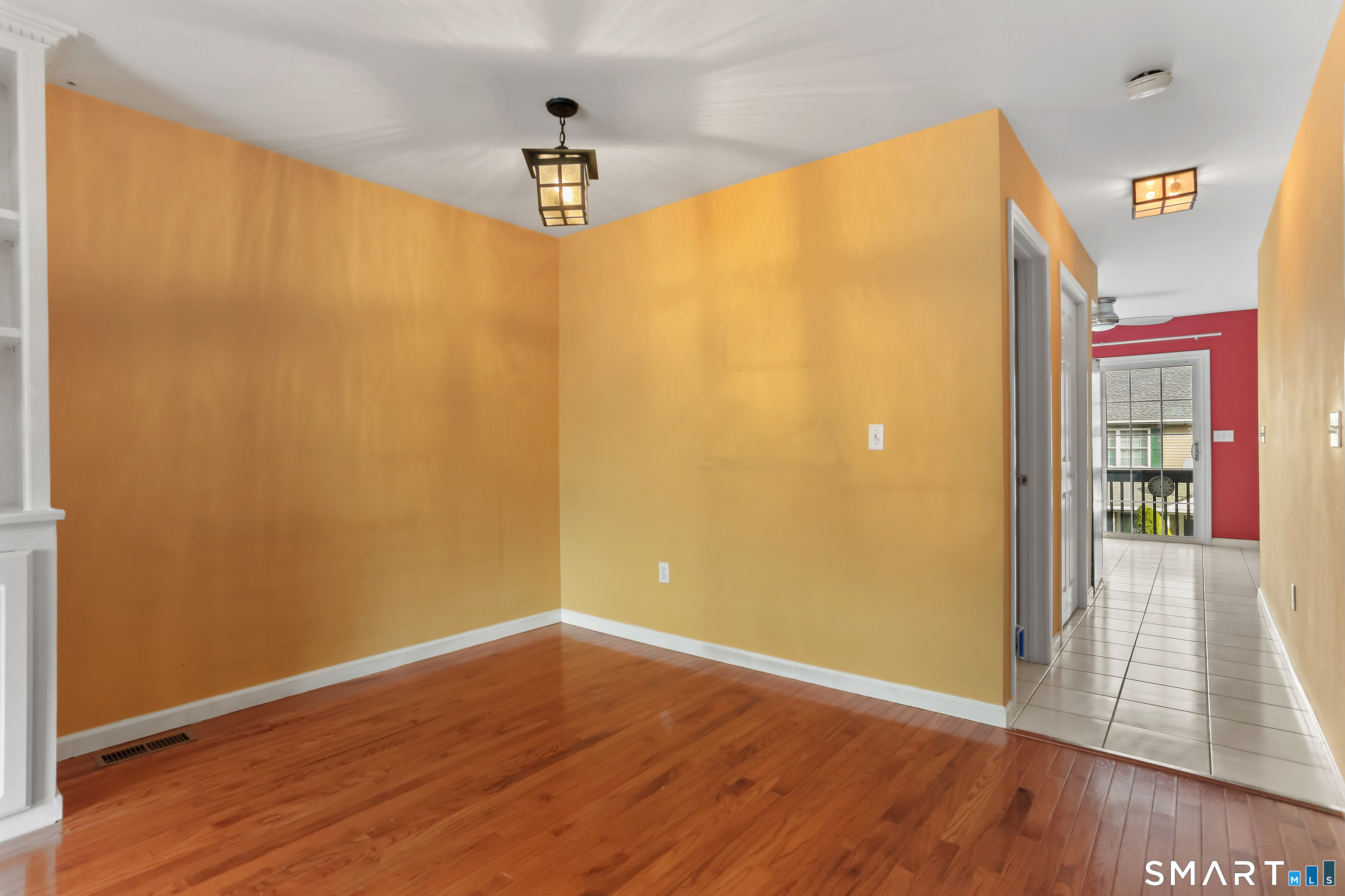 39 Coram Road, Unit 1 Shelton, CT 06484 - Photo 6 of 28 a view of a big room with wooden floor and windows