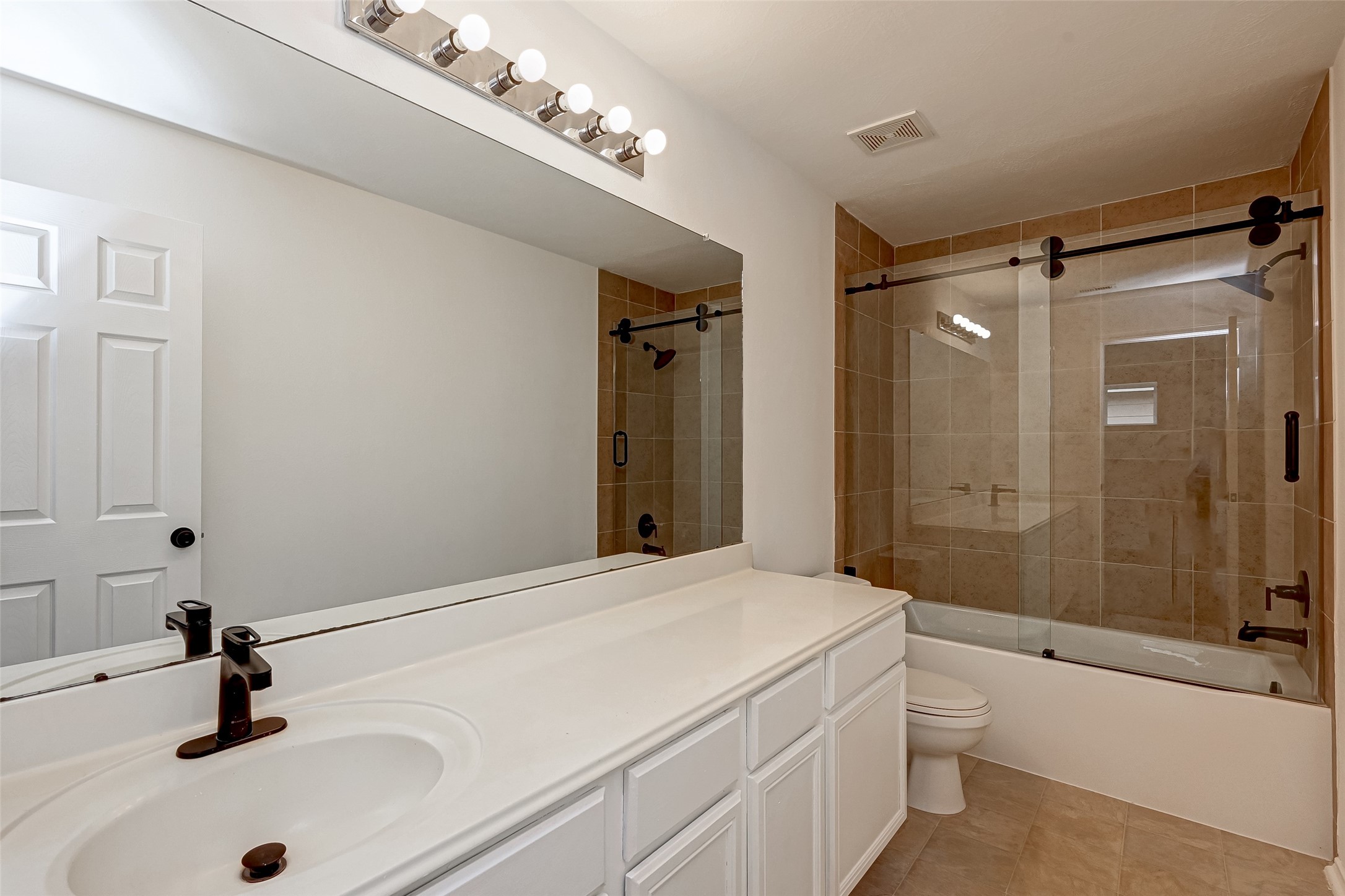 6906 Anson Point Lane Houston, TX 77040 - Photo 20 of 31 a bathroom with a sink a toilet and shower