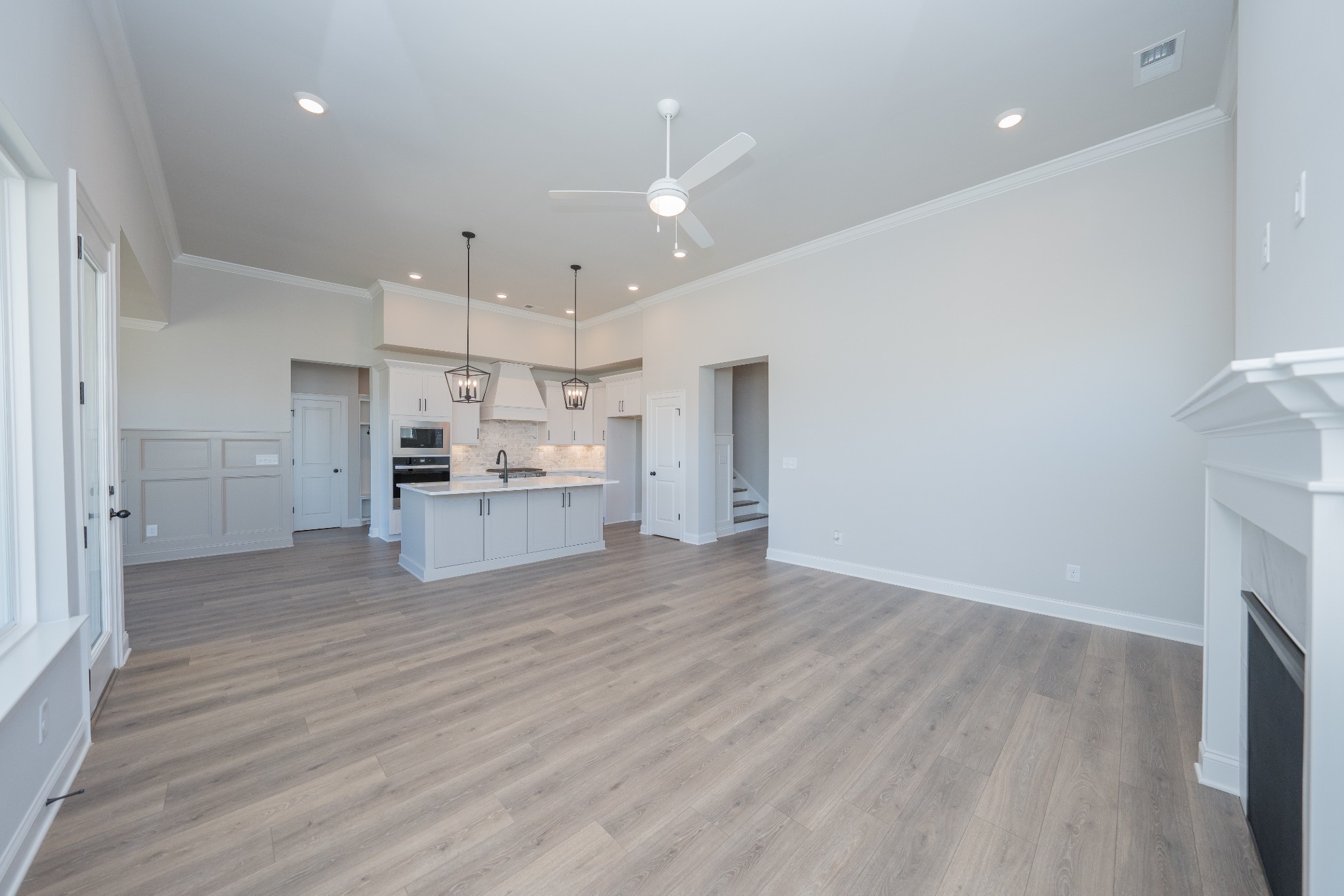 3033 Shandor St Spring Hill Spring Hill, TN 37174 - Photo 11 of 70 a view of kitchen with refrigerator stove and wooden floor