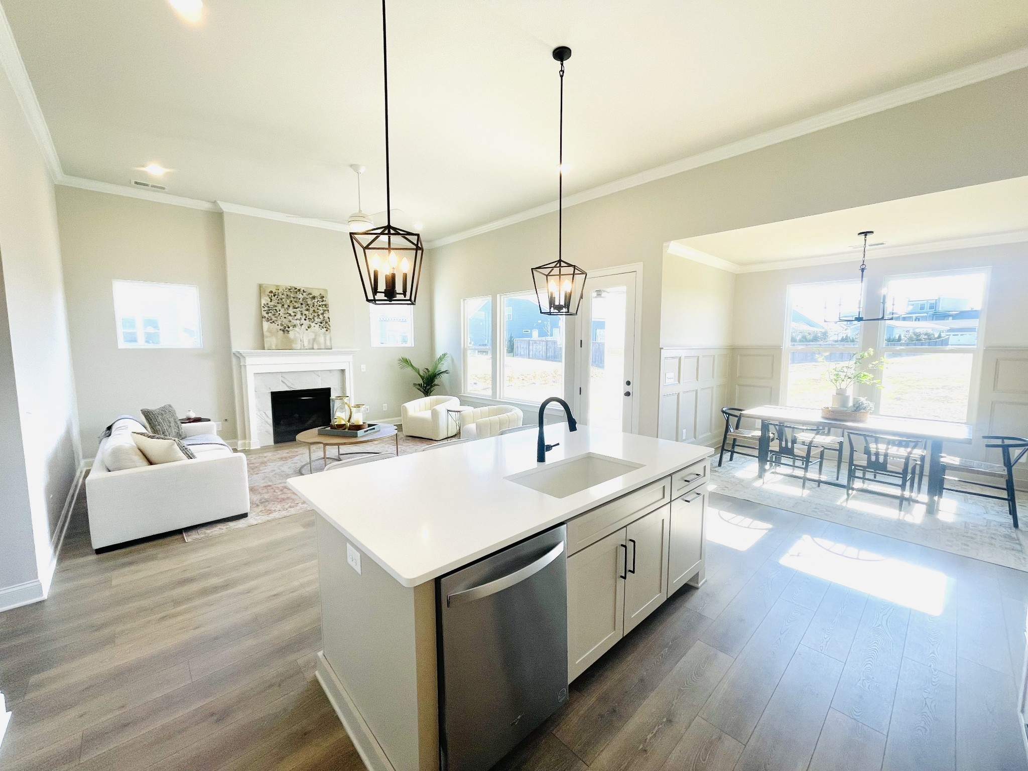3033 Shandor St Spring Hill Spring Hill, TN 37174 - Photo 4 of 70 a large kitchen with stainless steel appliances kitchen island granite countertop a stove a sink a center island a table and chairs