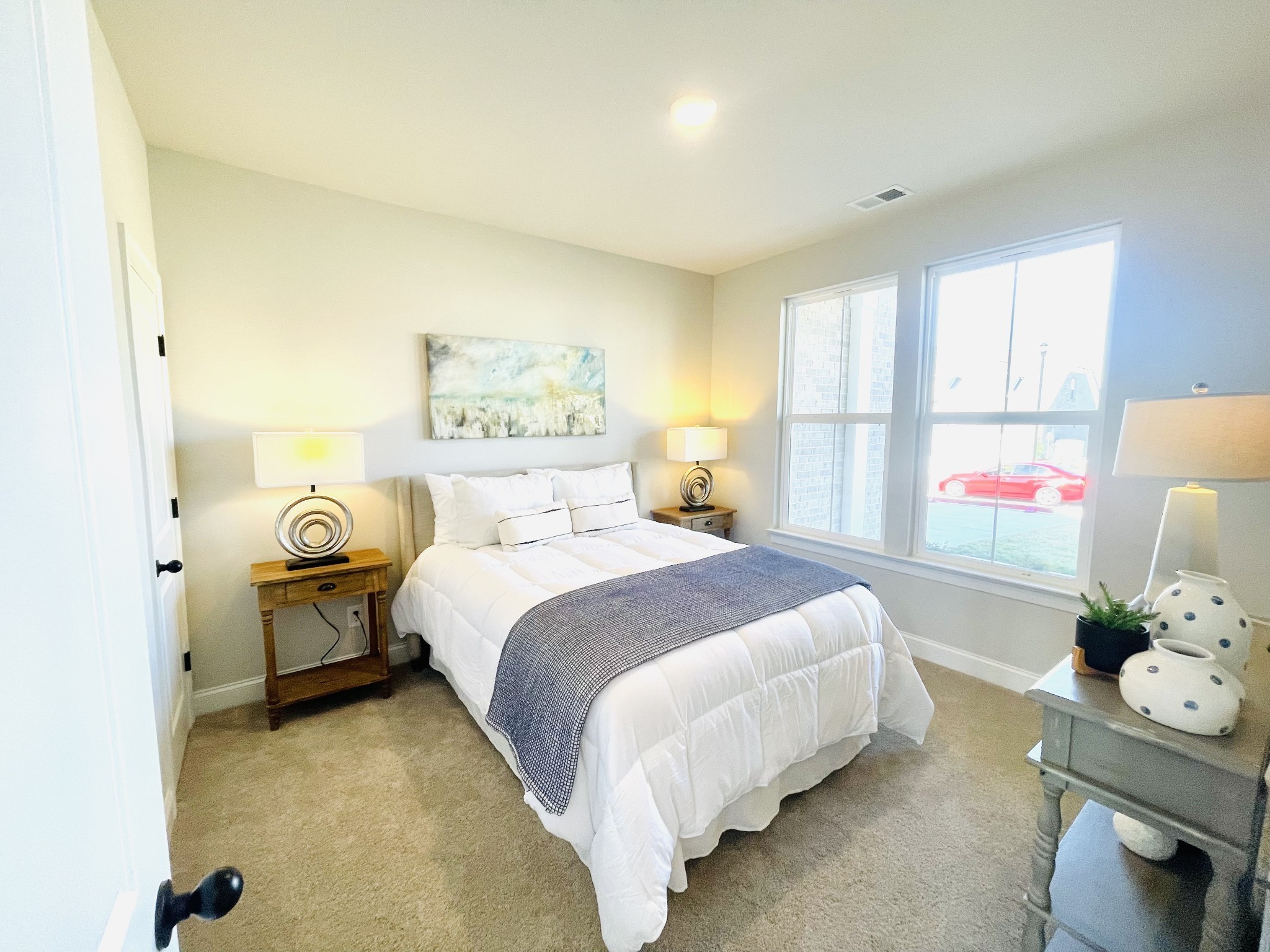 3033 Shandor St Spring Hill Spring Hill, TN 37174 - Photo 42 of 70 a bedroom with a bed table and a window