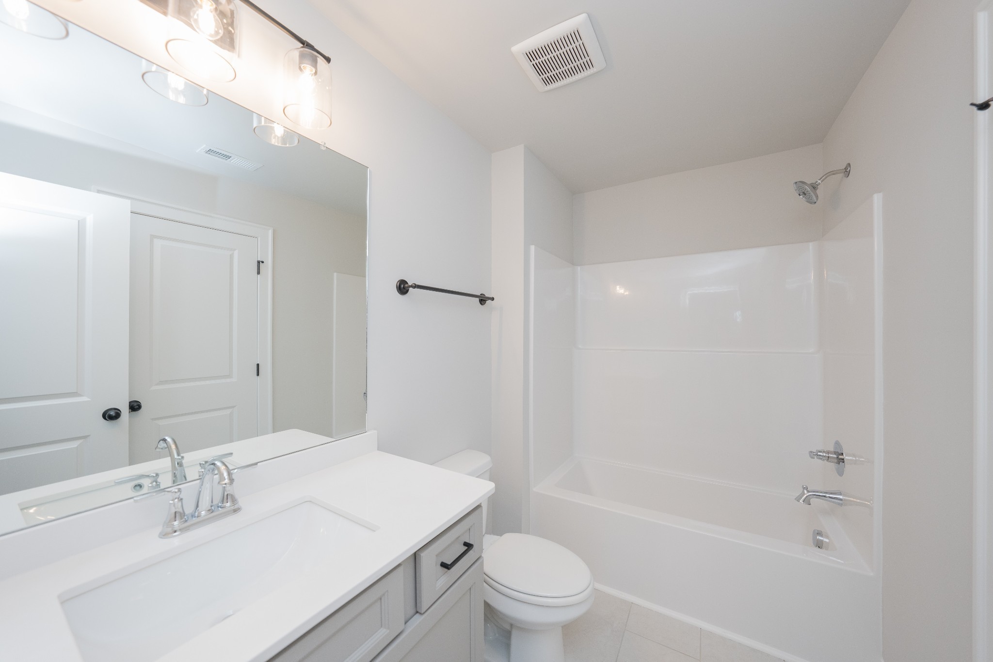 3033 Shandor St Spring Hill Spring Hill, TN 37174 - Photo 50 of 70 a bathroom with a bathtub shower sink vanity mirror and toilet