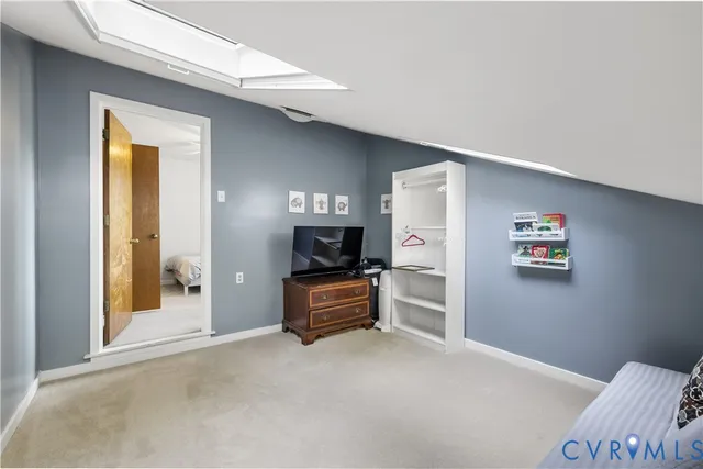 a view of a livingroom with furniture and windows