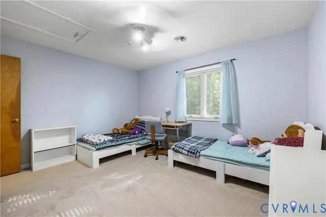 a bedroom with furniture and a window