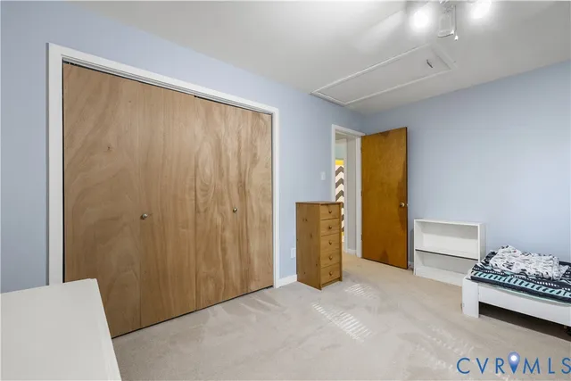 a view of livingroom with furniture and closet