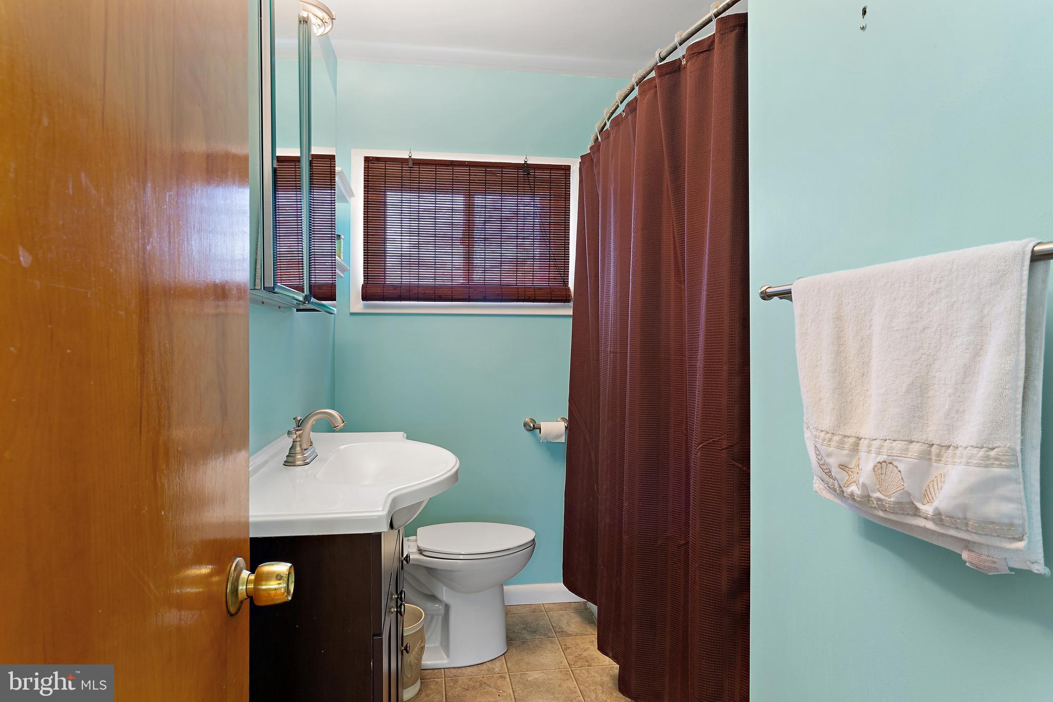 332 Baldwin Road Glassboro, NJ 08028 - Photo 11 of 24 a bathroom with a toilet and a sink