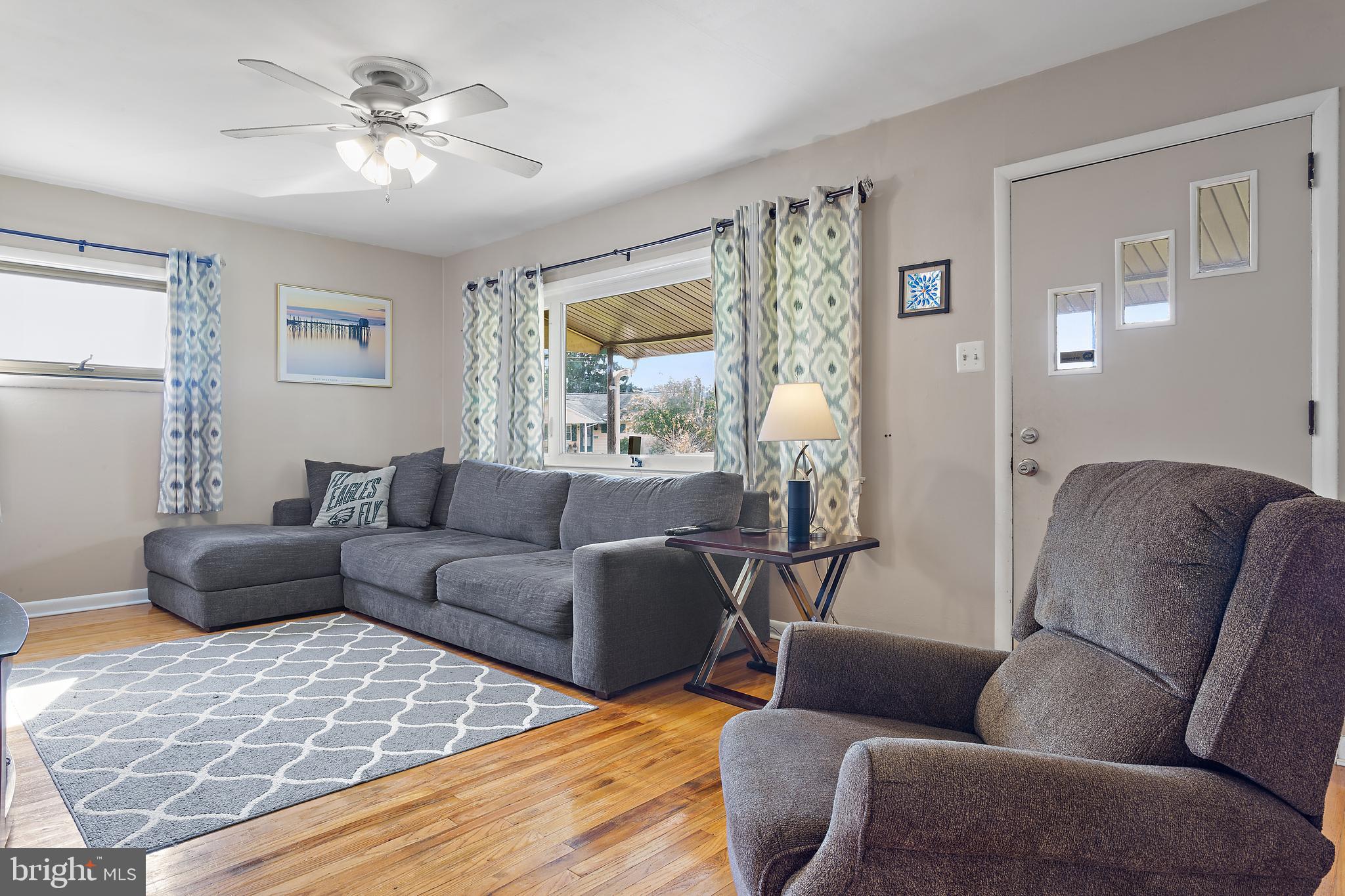 332 Baldwin Road Glassboro, NJ 08028 - Photo 5 of 24 a living room with furniture ceiling fan and a window