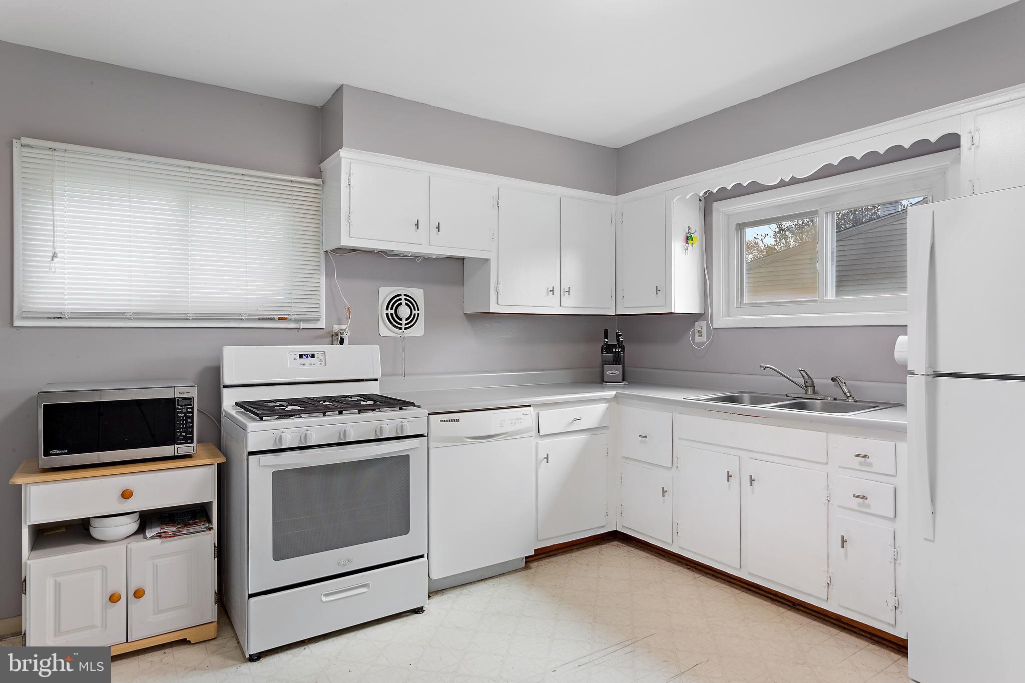 332 Baldwin Road Glassboro, NJ 08028 - Photo 7 of 24 a kitchen with cabinets stainless steel appliances and sink