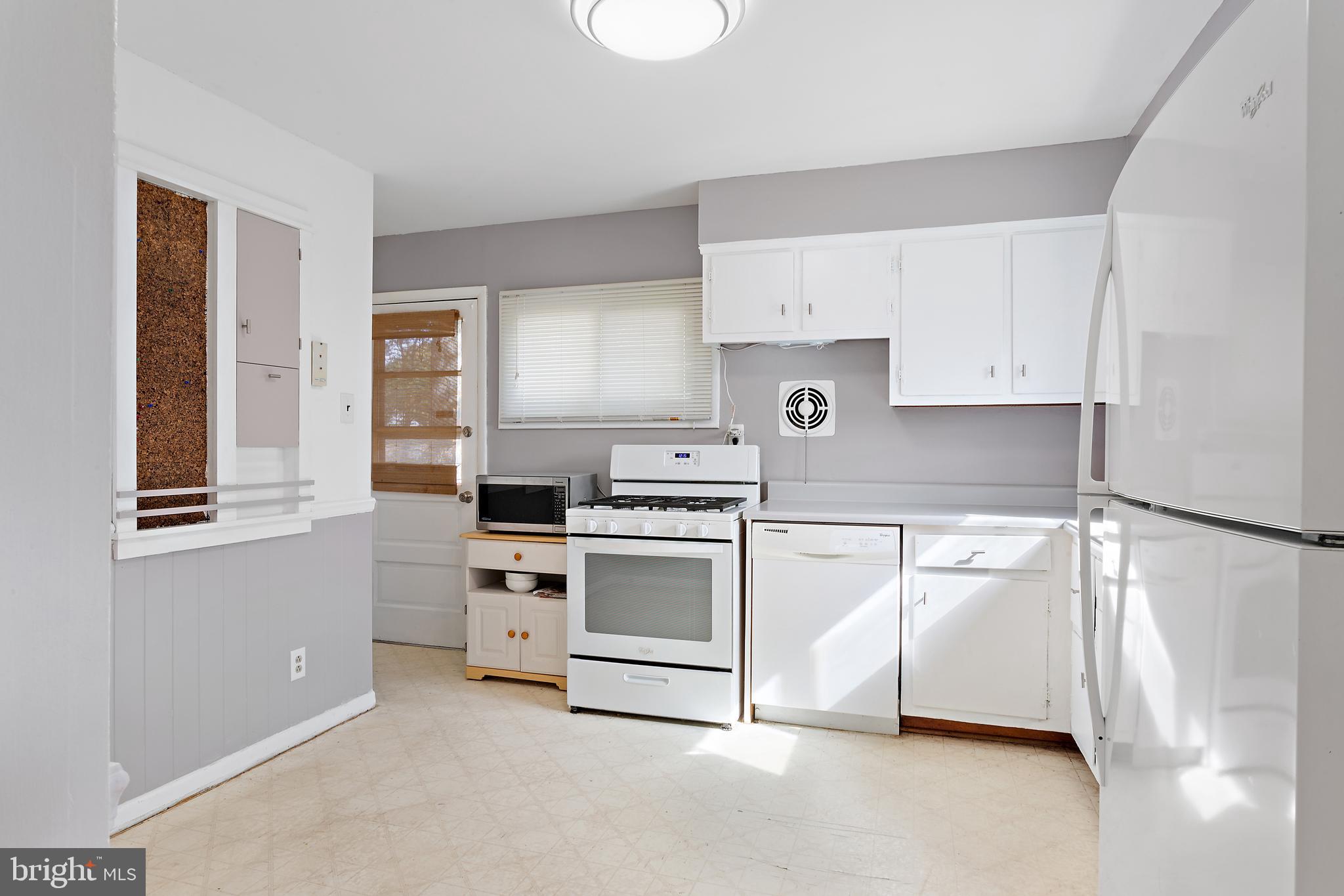 332 Baldwin Road Glassboro, NJ 08028 - Photo 10 of 24 a kitchen with cabinets appliances and a window