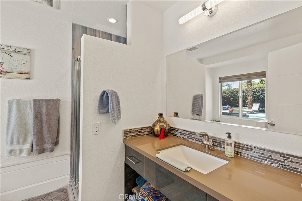 68190 Galardo Road Cathedral City, CA 92234 - Photo 13 of 24 a bathroom with a sink vanity and a mirror