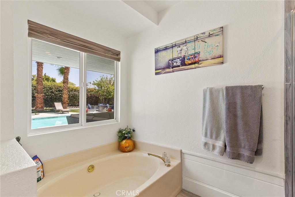 68190 Galardo Road Cathedral City, CA 92234 - Photo 14 of 24 a bathroom with a tub and a window