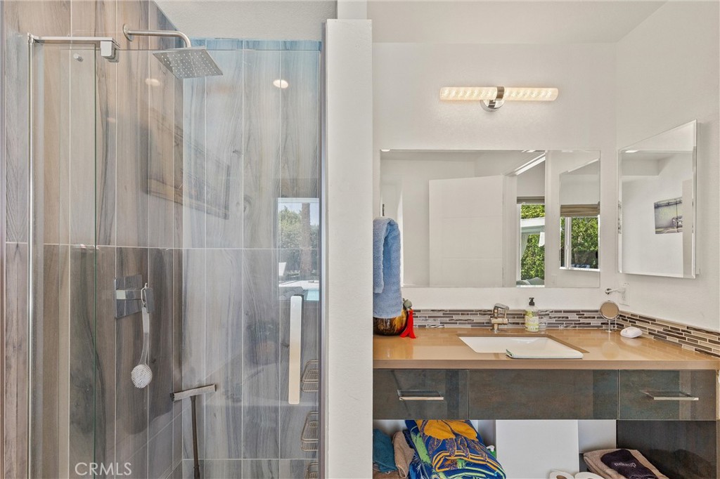 68190 Galardo Road Cathedral City, CA 92234 - Photo 15 of 24 a bathroom with a sink vanity granite and shower