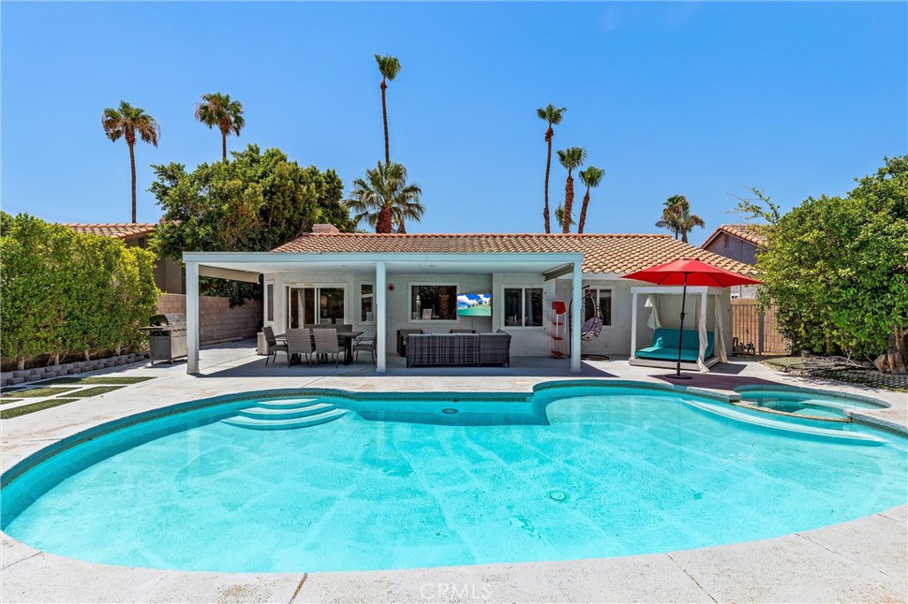 68190 Galardo Road Cathedral City, CA 92234 - Photo 20 of 24 a front view of a house with swimming pool having outdoor seating