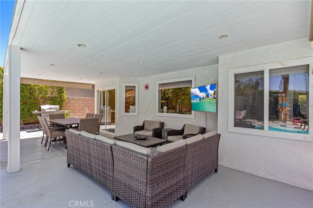 68190 Galardo Road Cathedral City, CA 92234 - Photo 6 of 24 a living room with furniture and a flat screen tv