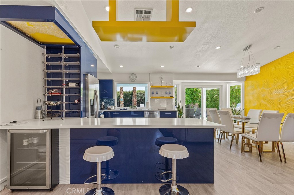 68190 Galardo Road Cathedral City, CA 92234 - Photo 8 of 24 a kitchen with a table chairs sink and cabinets